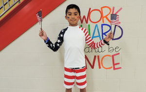  Student holding two flags